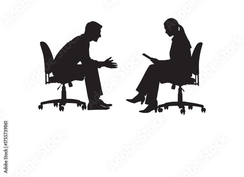 Silhouette of a woman sitting on a chair reading or drinking