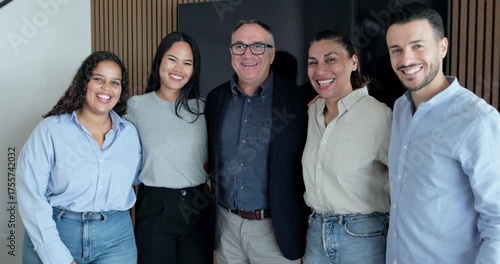 Multi generational business people smiling on camera inside company office - Multiracial colleagues having fun together - Job, relationship and corporate concept
