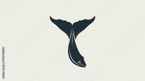 Dark silhouette of a fish descending with a large fluke-like tail