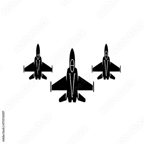 Three black fighter jets flying in formation