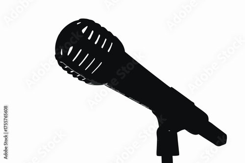 A hand holds a classic chrome vintage microphone for a studio audio broadcast