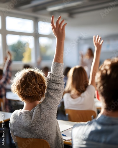 Students actively participate by raising hands in a bright sunlit classroom during a lesson