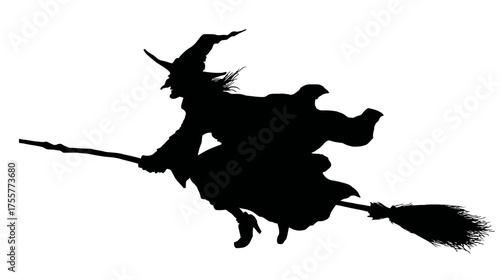 Silhouette of a witch in a pointed hat flying on a broomstick
