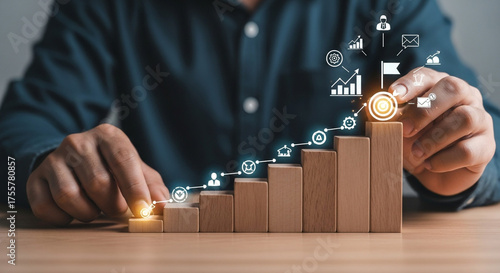 Ambitious business person strategically builds growth steps towards success with glowing goal achievement icons