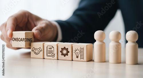 Seamless employee onboarding journey visualized with wooden blocks and icons symbolizing HR, growth, and teamwork for business success.