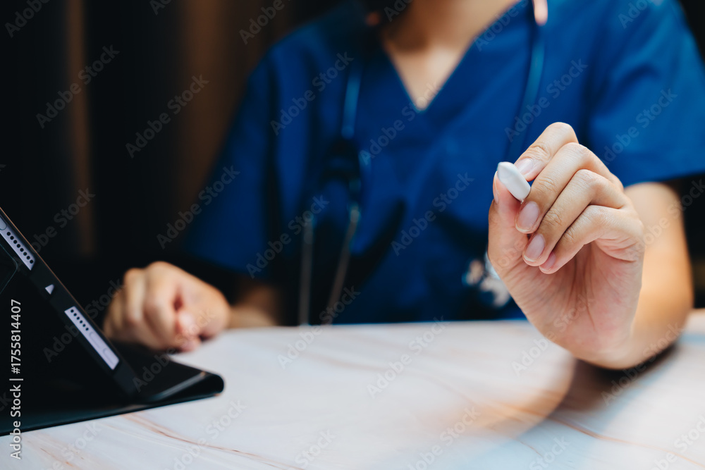 Fototapeta premium Digital Health concept. Healthcare Professional Holding Tablet in Modern Medical Office Setting with Focus on Digital Technology in Patient Care