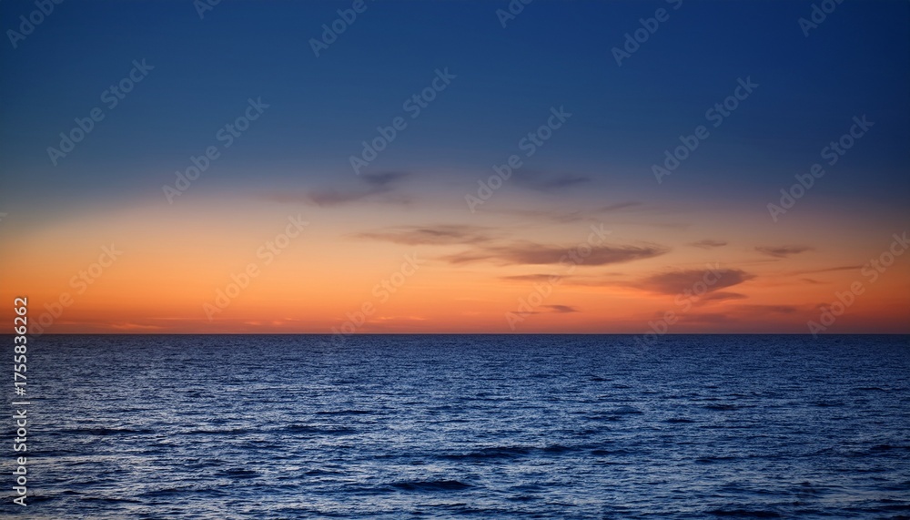 Obraz premium Dark Ocean Horizon With A Gradient Sky Transitioning From Blue To Orange