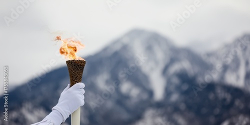 Olympic torch relay in snowy mountains for winter games