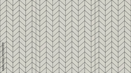 A seamless pattern of light gray chevron tiles with dark gray grout lines forming a zigzag design