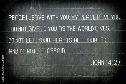 The Bible verse John 14:27 on chalkboard.