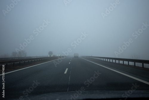 Driving in foggy weather on the highway. Driving in autumn and winter weather.