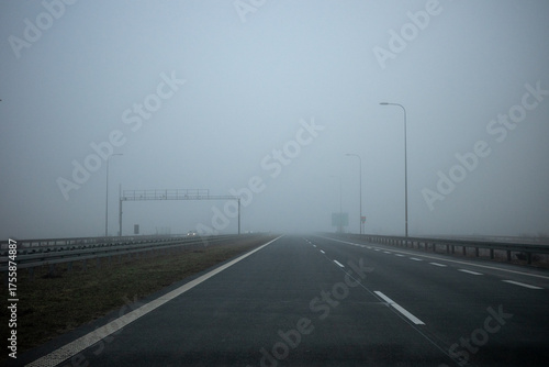 Driving in foggy weather on the highway. Driving in autumn and winter weather.