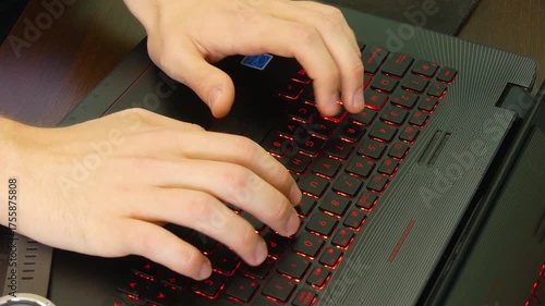 Focused Work of a Man Typing on Laptop with Watch Nearby