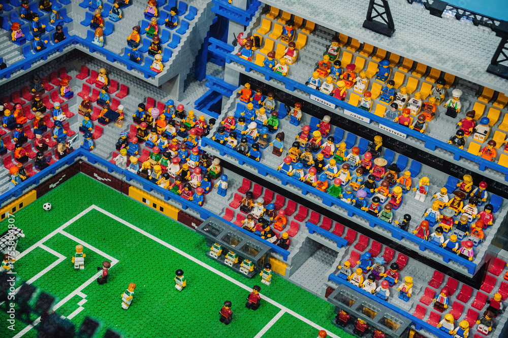 Fototapeta premium Prague, Czechia - September 20, 2025: Colorful LEGO football stadium packed with cheering fans