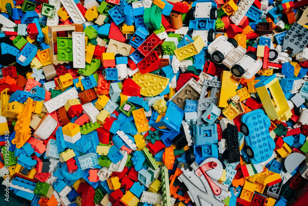 Naklejka premium Prague, Czechia - September 20, 2025: Colorful pile of assorted lego plastic construction bricks