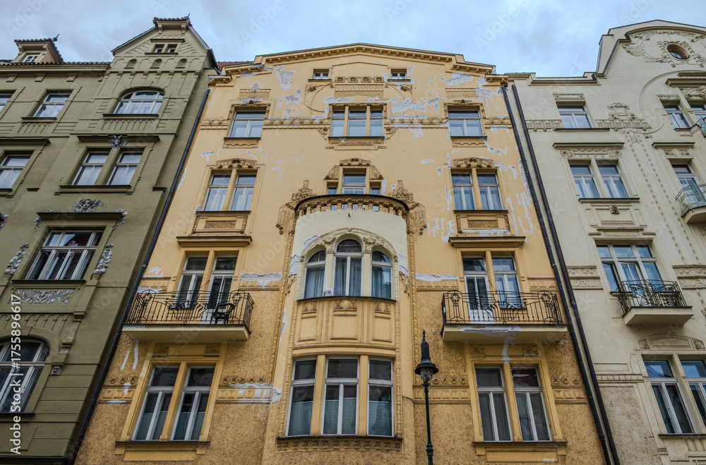 Fototapeta premium Historic building façade in Old Town Prague with visible damage and weathered details, reflecting the aging beauty and heritage of European architecture