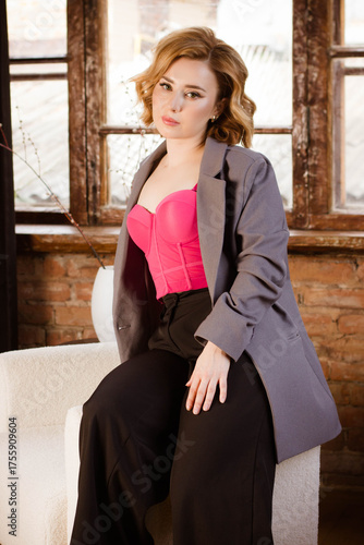 a young woman posing in a photo studio