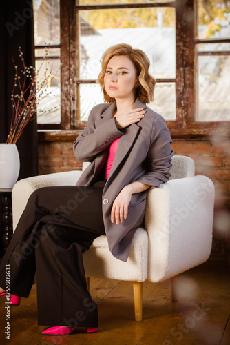 a young woman posing in a photo studio