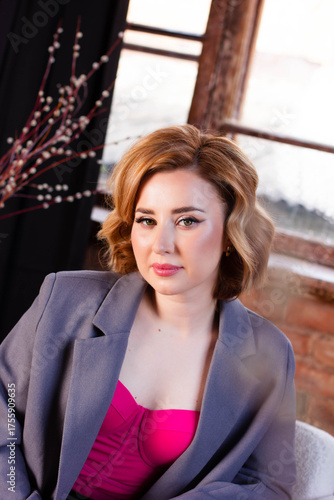 a young woman posing in a photo studio