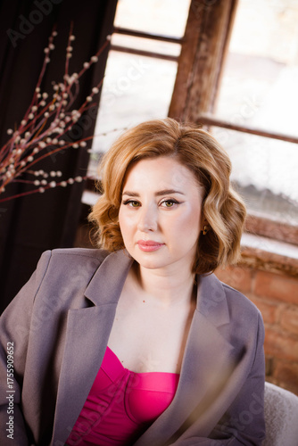 a young woman posing in a photo studio