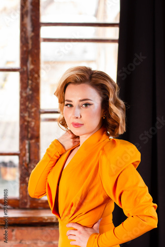 Blonde girl in a retro yellow dress