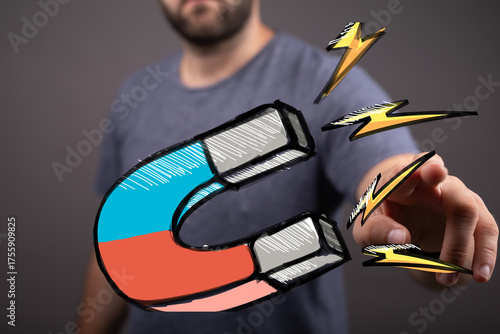 Hand pointing at a magnet, ...