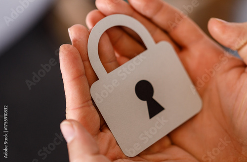 A hand holding a paper cuto...