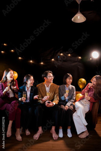  A group of beautiful girls at a company party, drinking, celebrating New Year, club party with friends.