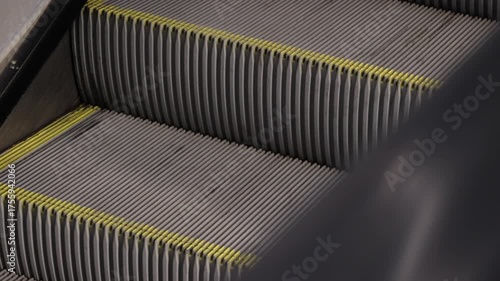 Automatic moving stairs in subway station, perfect for architecture, travel, and commuting themes.