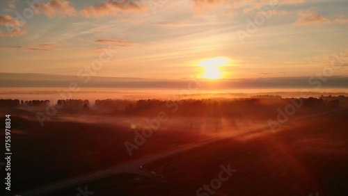 Wallpaper Mural Aerial view of sunrise over foggy forest landscape. Media Torontodigital.ca