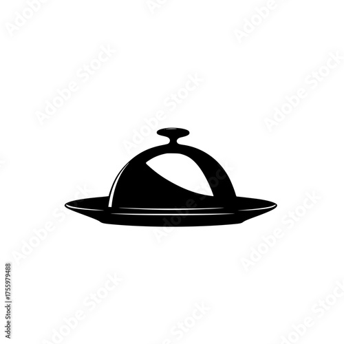Elegant food cover placed on a round plate in a stylish restaurant setting during evening dining