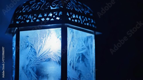 Mystic blue lantern illuminating frosted patterns in a darkened room ambience. 4k Video footage