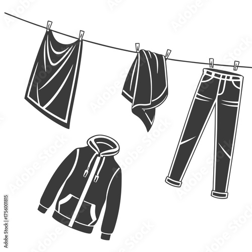 A collection of clothing items including a hoodie jeans and towels hanging on a clothesline to dry