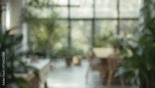 Soft-focus backdrop of a calm contemporary office space bathed in sunlight and surrounded by vibrant plants. Expansive glass panels and wooden fixtures foster a tranquil atmosphere ideal for