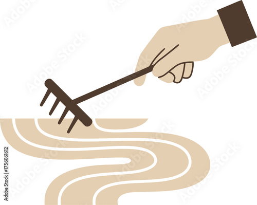 Hand raking sand in a Zen garden.