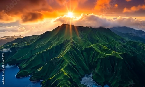 Dynamic sun rays over majestic mountain range with ocean view