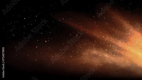 A vibrant golden nebula illuminates deep space casting a warm glow across a backdrop of glittering stars