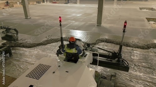 Laser screed machine pouring and leveling concrete floor. Clip