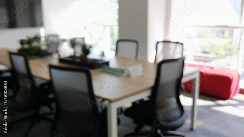 Blurry comfy view workplace,blur background,A vacant/available meeting room equipped with a large table and a projector.