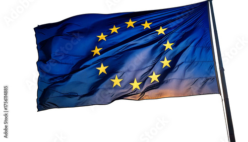 The flag of the european union, with its circle of stars, waving against a sunset white 