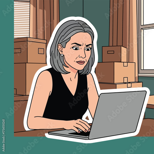 Woman focused on laptop amidst moving boxes