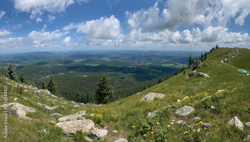 Fototapeta Naklejka Na Ścianę i Meble -  Stunning Wide-Angle View From Mountain Trail Under Clear Skies, Featuring Scenic Peaks and Rocky Formations During a Hike