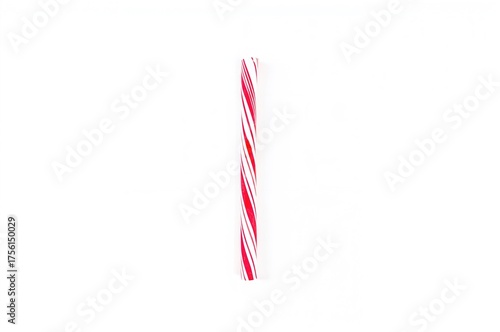 Single candy cane on plain ...