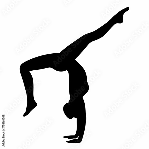 Silhouette of a gymnast in a one arm handstand with leg extended
