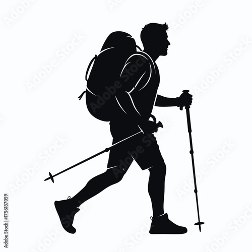 A hiker with backpack and trekking poles a striking black silhouette