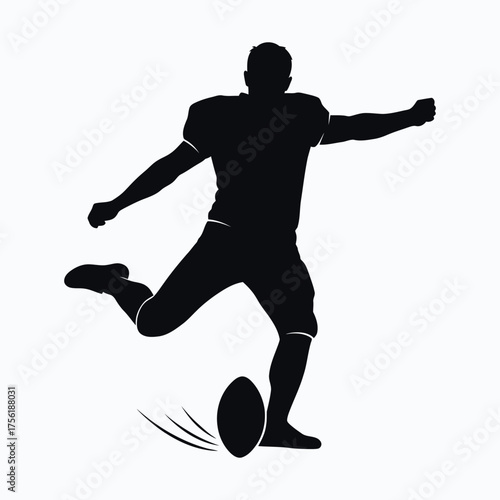 Dynamic rugby player in action kicking the ball a striking silhouette