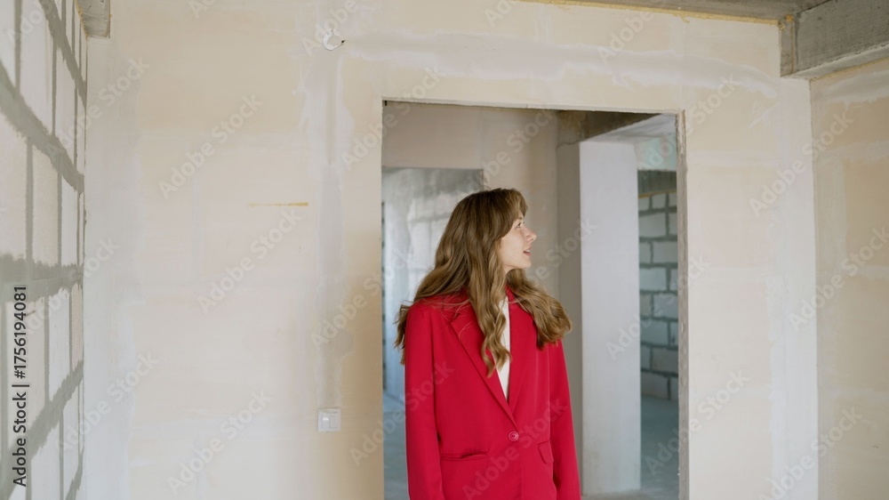 Fototapeta premium Real estate agent inspecting new property construction site