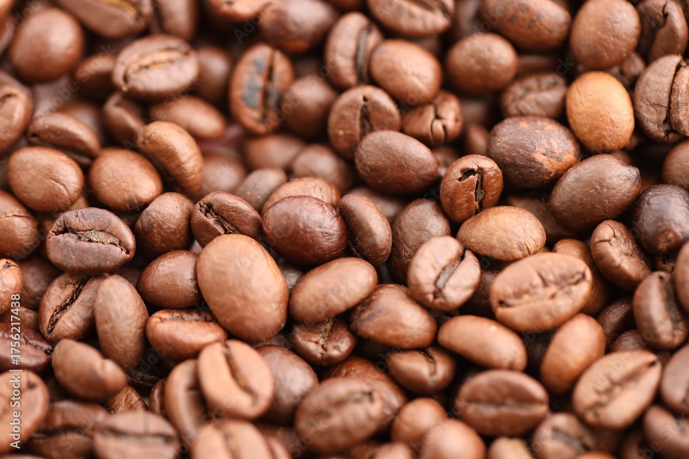 Naklejka premium Coffee texture roasted beans from above soft light close up