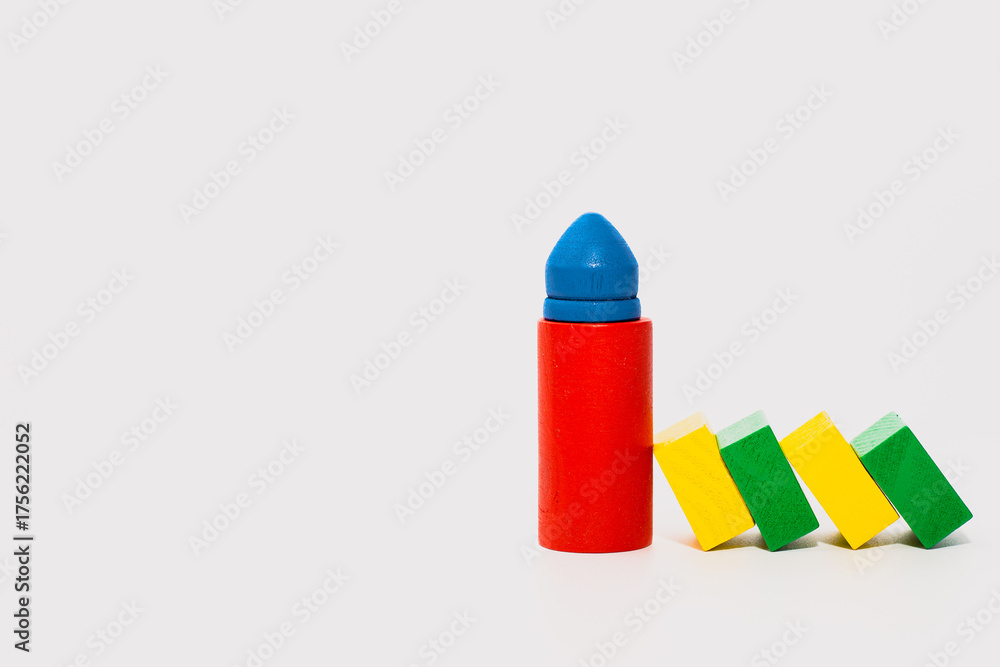 Fototapeta premium Colorful Wooden Blocks Leaning on Cylinder