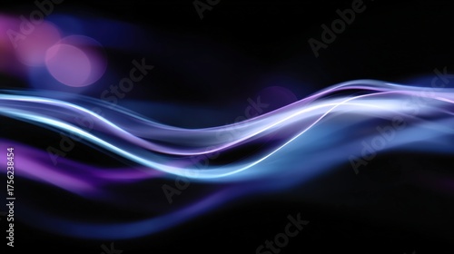 Abstract light streaks and energy flow on dark background